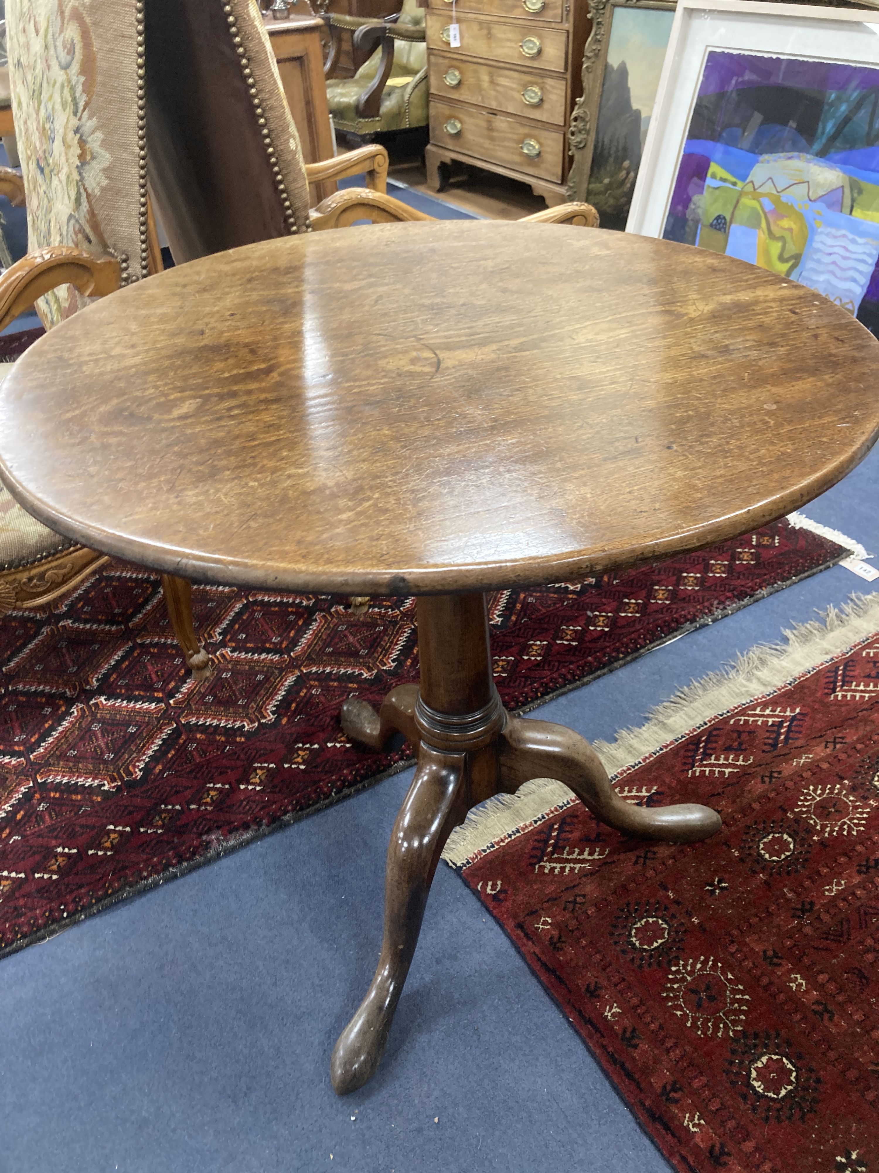 A mid 18th century mahogany tripod table with birdcage platform, diameter 76cm, height 70cm